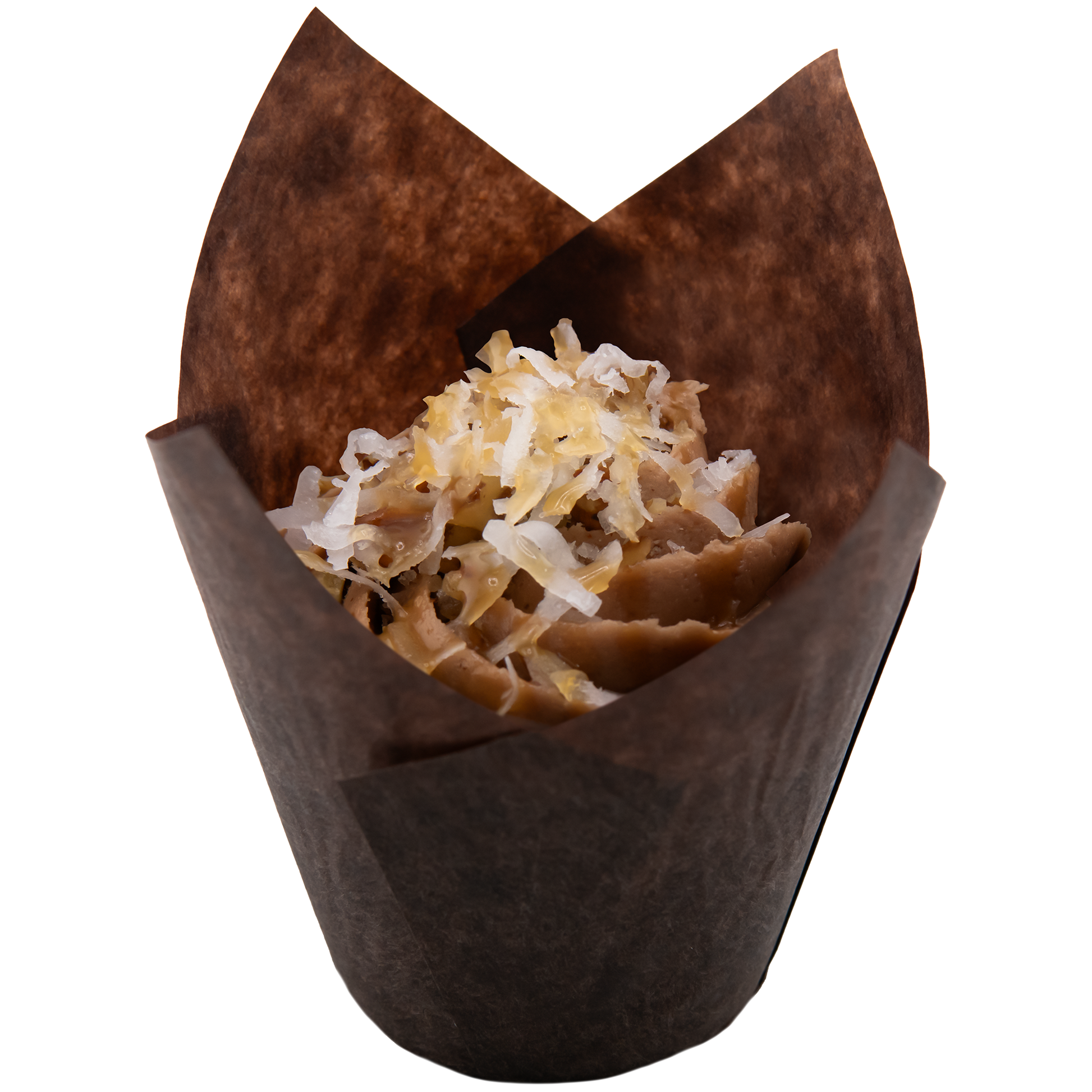 Cupcake in a brown wrapper topped with coconut shavings